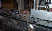 Drawer Box machine with miter folding heads for Doweled drawers and v Grooving for meter folding final drawer boxes.