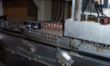 Drawer Box machine with miter folding heads for Doweled drawers and v Grooving for meter folding final drawer boxes.