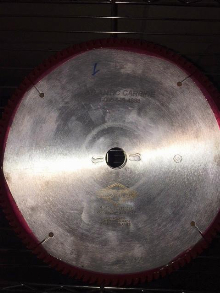 New and newly sharpened panel saw blades