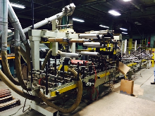 Used Dusphol Model SUP-F-500-HTEVA Wrapper and Used Dusphol Model DLBAR/QR 10â€ x 142â€Long Power Roller Conveyor