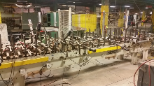 Used Dusphol Model SUP-F-500-HTEVA Wrapper and Used Dusphol Model DLBAR/QR 10â€ x 142â€Long Power Roller Conveyor